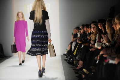 Models present outfits during the Honor
