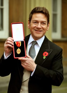 Kenneth Branagh, with his award from the Queen after his knighting (Getty Images)