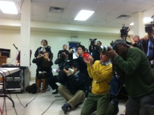 Photographers capture pictures of the subway victim's family.