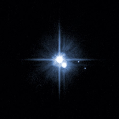 Hi there! (NASA Photo: H. Weaver (JHU/APL), A. Stern (SwRI), and the HST Pluto Companion Search Team, Via WikiMedia)