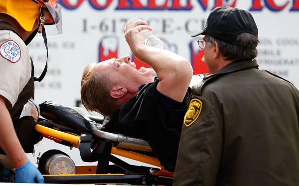 A man is loaded into an ambulance after he was injured by one of two bombs exploded during the 117th Boston Marathon near Copley Square on April 15, 2013 in Boston, Massachusetts. (Getty Images)
