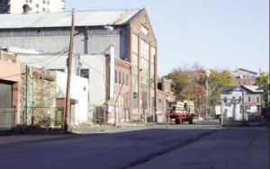 The site is currently made up of vacant lots and underused industrial structures.