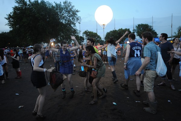 Concert-goers cavort in the mud at the Governors Ball. (Getty)