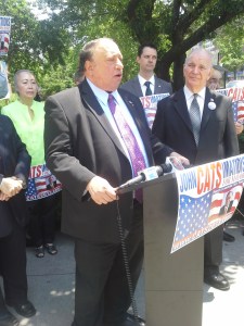 Republican John Catsimatidis speaks outside of Queens Borough Hall.