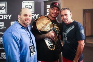 Tyrone Spong (center) took home the championship belt and $200,000 prize