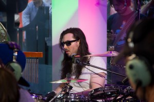 Andrew W.K. drumming at the Oakley store on Time Square. (Photo by Hugh Bassett).