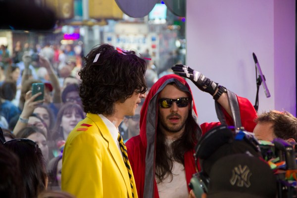 Andrew W.K. receiving his World Record from a world record official. (Photo by Hugh Bassett)