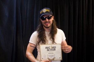 Andrew W.K. posing with his new world record. (Photo by Hugh Bassett)