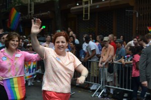 Christine Quinn exuberantly greeting the crowd on the parade route.
