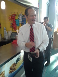The former governor buys a cup of coffee.