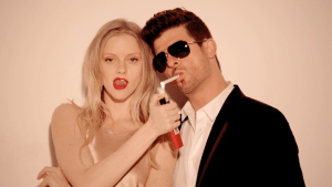 Model Elle Evans with Robin Thicke.