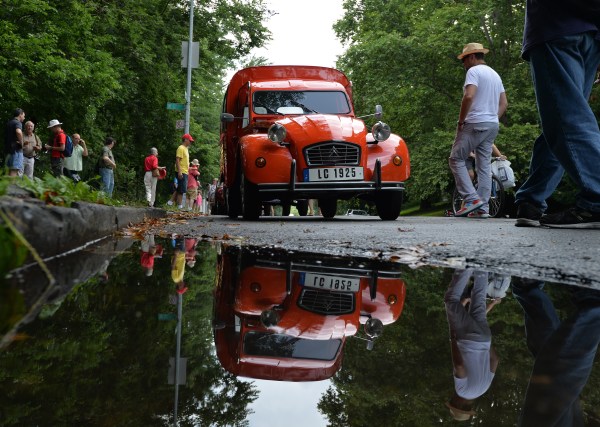 A Citroen 2CV Truckette before a parade of Citroen cars and Velosolex bicycles from the Greater New York Citroën and Velosolex Touring Club on Bastille Day July 14, 2013 in New York.