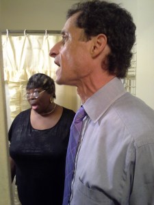 Anthony Weiner tours an apartment building in Harlem.
