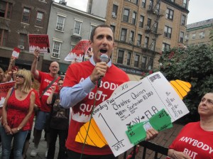Anti-Quinn activist Donny Moss with Ms. Quinn's pretend parting gifts.