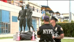 The defaced statue. (CBS)