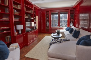 A red library, whose owners were apparently not even interested in pretending that they own readable books.