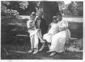 Ms. Clark's, shown here as a tow-headed child with her sister, mother and father. From the book Empty Mansions. 