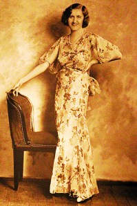 Friends and the few relatives who knew her described her as shy but not sad. Here she poses in a Japanese print dress at about age 37. The Estate of Huguette M. Clark, from the book Empty Mansions.