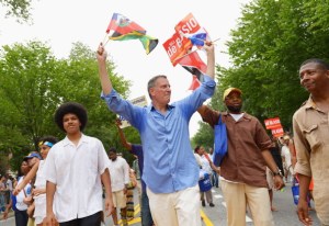 Bill de Blasio campaigns with his son in the West Indian Day Parade. (Photo: Getty)