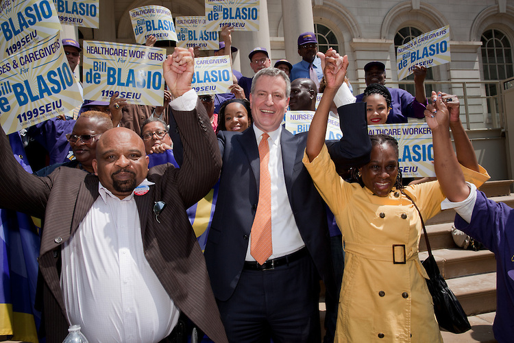 George Gresham (left) celebrates the endorsement of Bill de Blasio.
