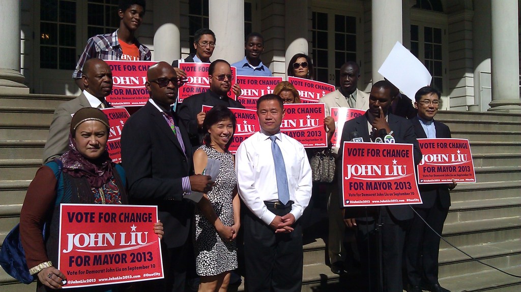 Mayoral Candidate John C. Liu stands with clergy members and community activists on the steps of City Hall today.