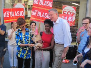 Diamond the Pomeranian poses with her owner Sheila Baker and Bill de Blasio.