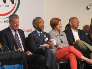 The candidates on stage at the National Action Network.