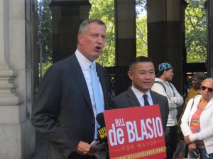 Bill de Blasio being endorsed by John Liu.