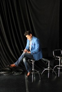 The former publicist/columnist/TV host checks his smartphone for a dish.