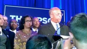 Bill Thompson standing beside his wife on stage tonight.