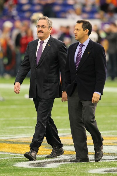 It’s good to own the Vikings. Brothers Zygi and Mark Wilf take the field. (Photo by Adam Bettcher /Getty Images)