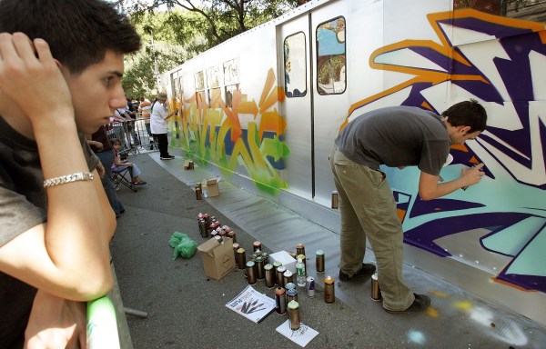 Spraypainters at "Getting Up." (Photo by Mario Tama/Getty Images)