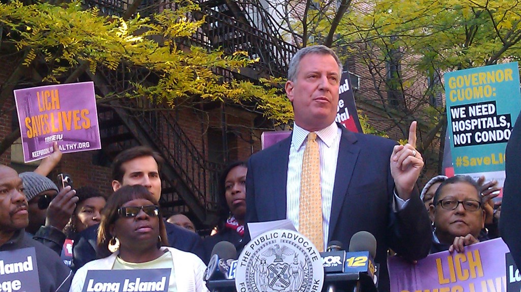 Mayoral front-runner Bill de Blasio stands with Long Island College Hospital workers and healthcare union during a conference today.