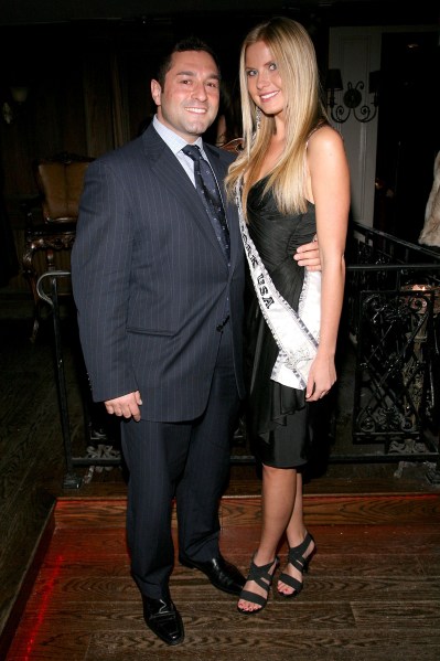 Gennaro Pecchia takes time out from his tubers for a photo with former Miss New York Amber Collins. (Photo: Getty)