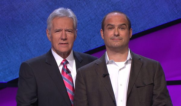 BFFs Alex Trebek and Neal Pollack post on the set of Jeopardy