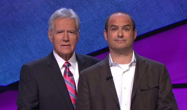 BFFs Alex Trebek and Neal Pollack post on the set of Jeopardy