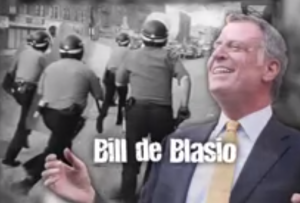 Bill de Blasio laughs as riots occur.