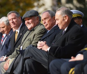 Bill de Blasio and Michael Bloomberg sitting one seat apart earlier this week. (Photo: Getty/Michael Loccisano)