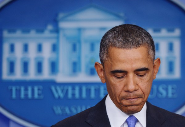 President Barack Obama pauses as he speaks on the Affordable Care Act in the Brady Press Briefing Room. (Photo by MANDEL NGAN/AFP/Getty Images)