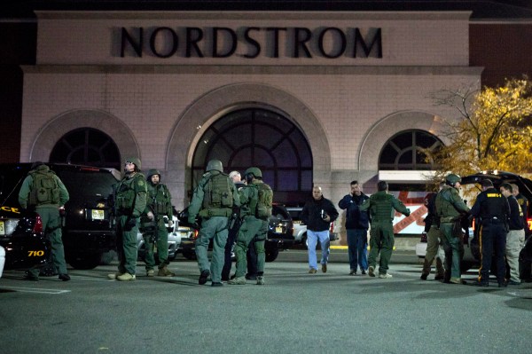Officials wearing tactical gear walk outside of Garden State Plaza Mall following reports of a shooter. (Photo by Kena Betancur/Getty Images)