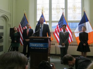 Bill de Blasio and the leaders of his transition team.