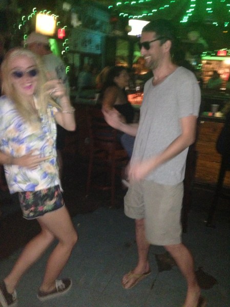 A blurry Lindsay Lohan and Ray LeMoine get ready to flee.