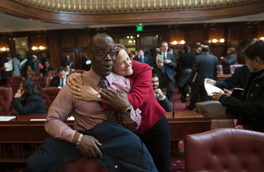 Speaker Melissa Mark-Viverito hugs Councilman Daneek Miller. (Photo: William Alatriste/NYC Council)