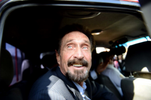 John McAfee probably smiled like this at the exciting news. (Getty)