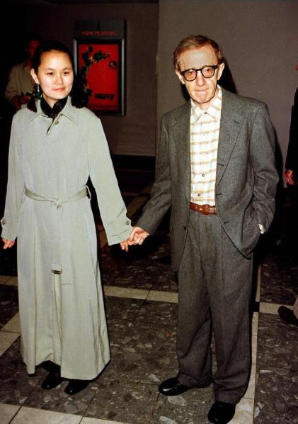 LOS ANGELES, UNITED STATES: Actor-director Woody Allen (R) and his adopted daughter and girlfriend, Soon Yi Previn arrive for the world premiere of his new film, "Deconstructing Harry" 05 December in Los Angeles. The film stars, among others, Mariel Hemingway, Demi Moore and Elisabeth Shue and opens in the United States 12 December. (Vince Bucci/AFP/Getty Images)