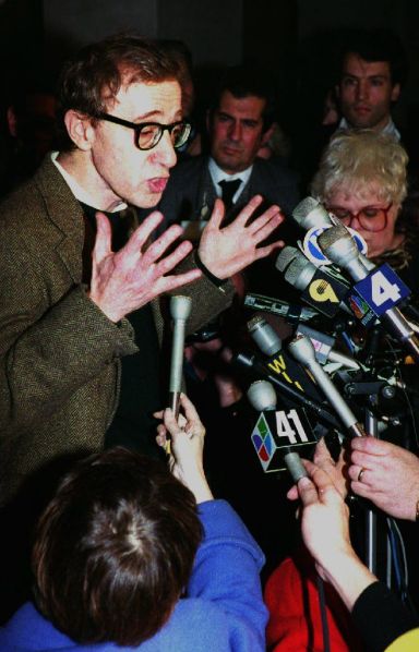 NEW YORK, NY - DECEMBER 16:  U.S. Actor-Director Woody Allen (L) speaks to reporters in New York, NY after a pre-trial hearing 15 December, 1992 on the custody fight between Allen and former girlfriend Mia Farrow. Farrow's lawyers are asking that Allen not be allowed to contact his adopted daughter Dylan and not seek custody when his wife dies.  (Photo credit should read HAI DO/AFP/Getty Images)