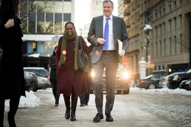 Bill de Blasio walking down the street with his wife, Chirlane McCray. (Photo: Rob Bennett/NYC Mayor's Office)