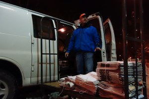 Brian Carey making morning deliveries. (Photo: Molly Dektar)