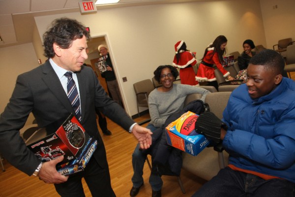 CareOne CEO Daniel Straus hands out holiday presents at Beth Israel Hospital in Newark, NJ.