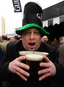 A man holds some Guiness during some St. Patrick's Day celebrations. (Photo: Alan Crowhurst/Getty)